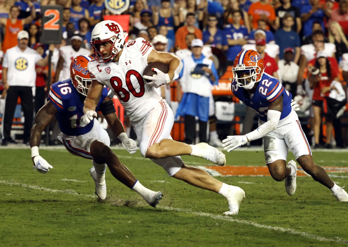 Utah Utes tight end Brant Kuithe (80) runs with the ball against the Florida Gators during the second quarter at Steve Spurrier-Florida Field.